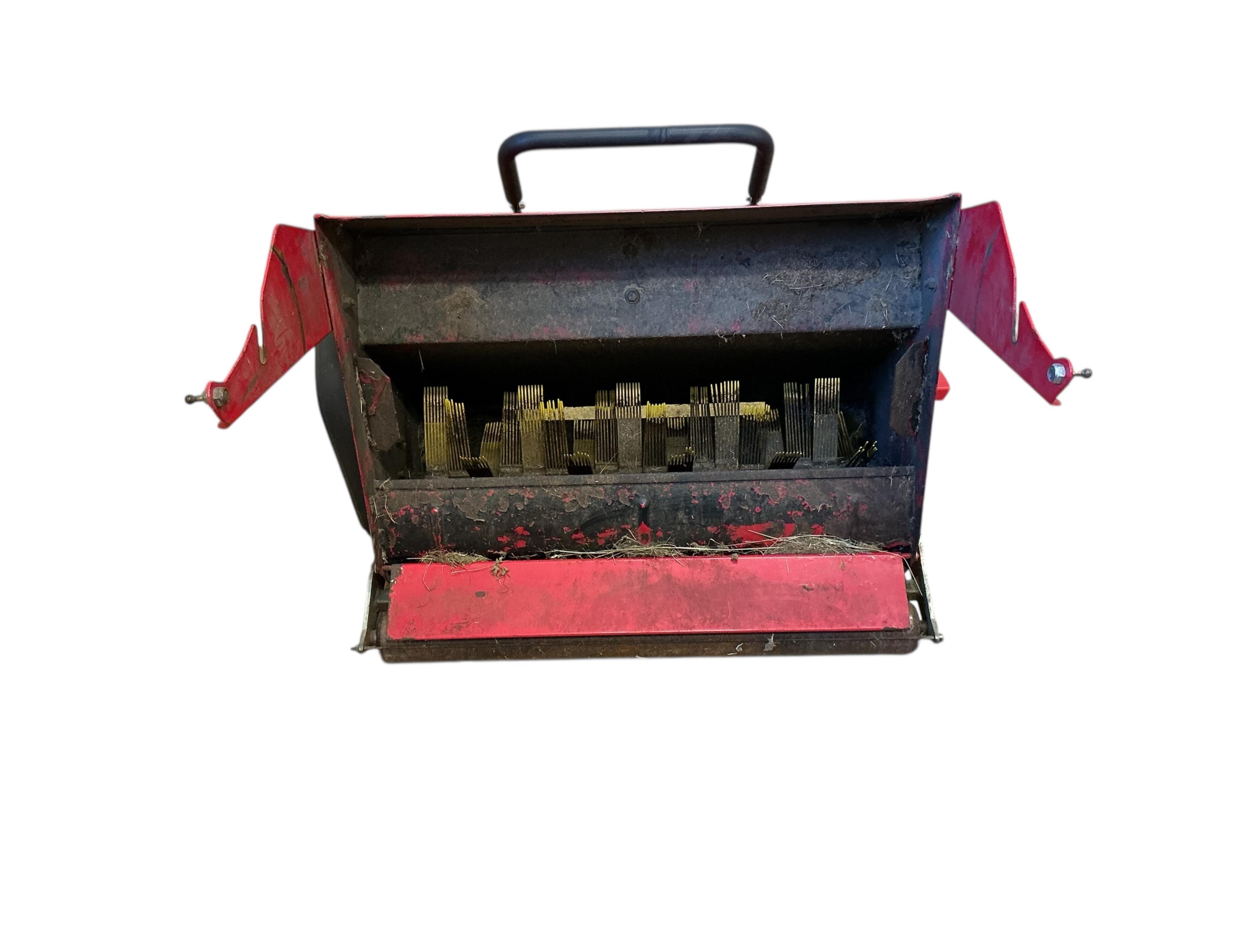 A Westwood S1300 ride on mower with scarifier and brass box attachments